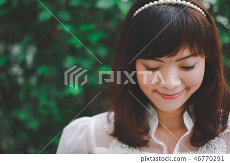 Close up of young pretty Asian woman. Close up of young pretty Asian woman. 46770291