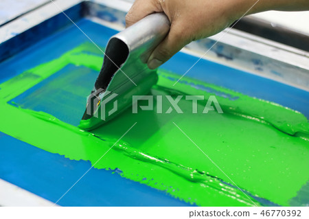 Hand pressing silk-screen printing, close up view. 46770392