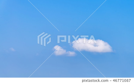 Blue sky with small white clouds. Blue sky with small white clouds. 46771087