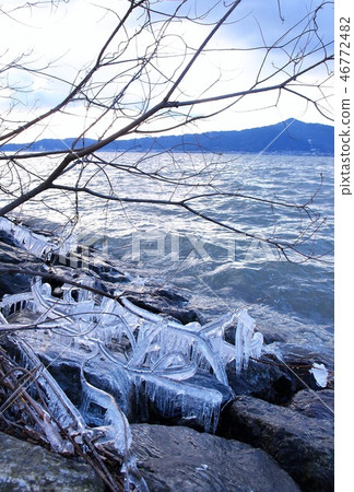 Lake Biwa in winter, splashing ice and mountains of Hiei 46772482