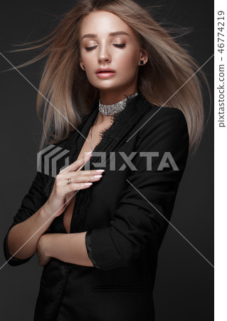 Beautiful woman with evening make-up and long straight hair . Smoky eyes. Fashion photo. 46774219