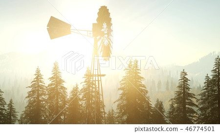Typical Old Windmill turbine in forest at sunset Typical Old Windmill turbine in forest at sunset 46774501
