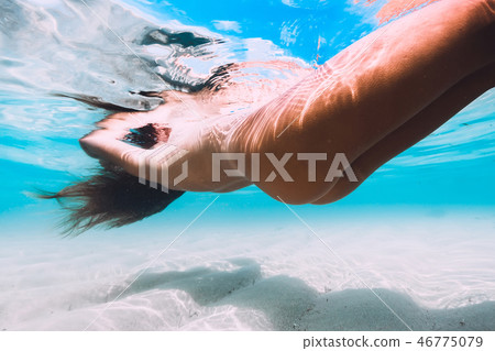 Woman floating and relax in tropical ocean. Nude 46775079