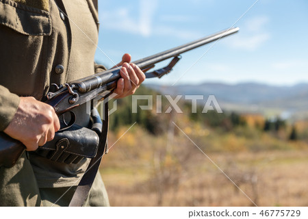 Guard on the environment at work, shotgun in hands Guard on the environment at work, shotgun in hands 46775729