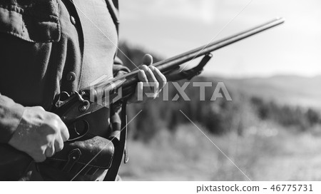 Hunter with horizontal double-barreled shotgun Hunter with horizontal double-barreled shotgun 46775731