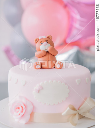 festive pink cake with bow bear top 46777588