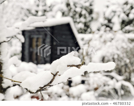 branches and wooden hut under snow in winter branches and wooden hut under snow in winter 46780332