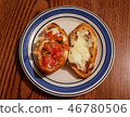 Molletes made of sliced bolillo bread with cheese 46780506