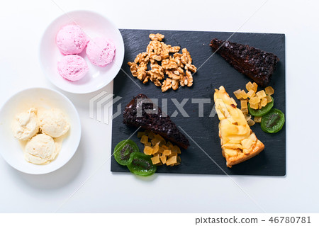 Top view of desserts on white background. 46780781