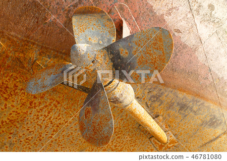 Rusty screw and the underwater part of a hull 46781080