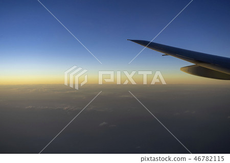 Plane wings with the sky in evening 46782115