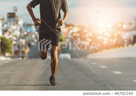 Athlete runner feet running on road 46782149