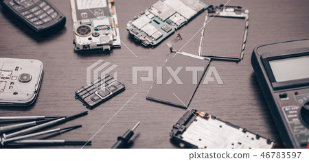 disassembled mobile phone and tools 46783597
