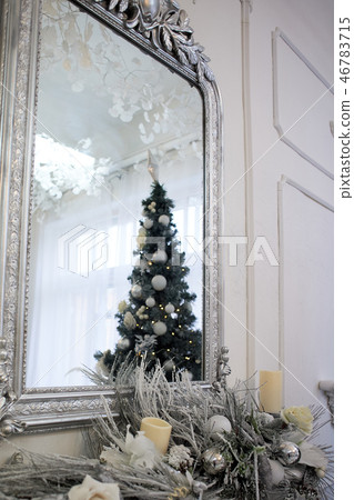 Christmas tree reflection in the mirror.Christmas atmosphere in a bright room 46783715