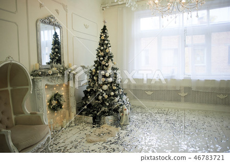 Massive old chair with light fabric upholstery and high closed back. The new year atmosphere. Palace 46783721