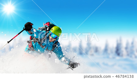 Young man skiing on piste 46784138