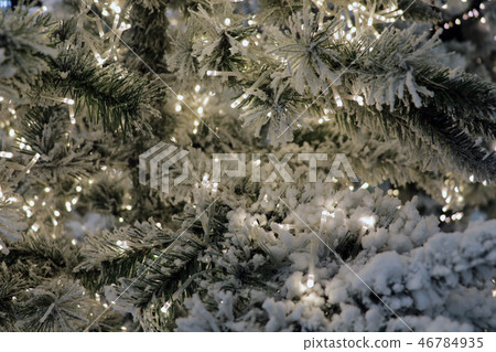 Christmas toys on the Christmas trees in New Year's Eve. New Year and Christmass green decoration 46784935