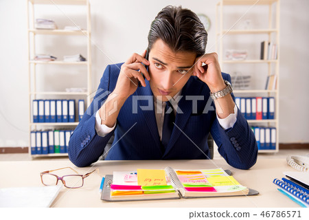 Young handsome employee planning his work activity  46786571