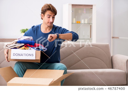 Concept of charity with donated clothing 46787400