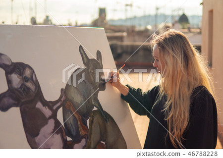 Young woman paint artist drawing at home roof 46788228