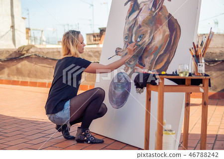 Young woman paint artist drawing at home roof Young woman paint artist drawing at home roof 46788242