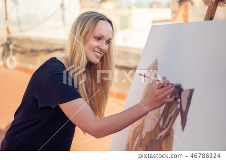 Young woman paint artist drawing at home roof Young woman paint artist drawing at home roof 46788324