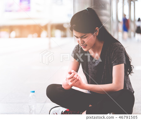 Sport woman having an injury on her wrist hand Sport woman having an injury on her wrist hand 46791505