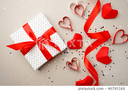Gift box with red bow ribbon and red origami Gift box with red bow ribbon and red origami 46795168