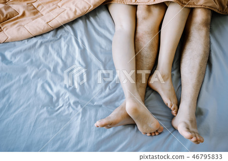 Asian couple in the bedroom on holiday morning. 46795833