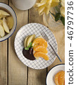 poached apples & fresh orange with chocolate sauce 46797736