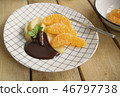 poached apples & fresh orange with chocolate sauce 46797738