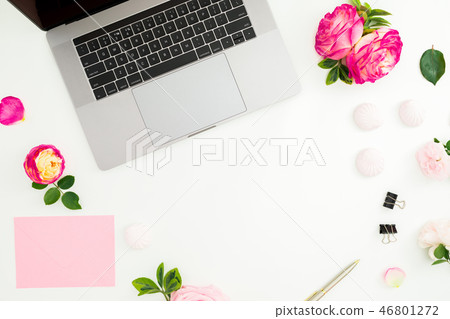 Frame with laptop, envelope, pen and roses flowers 46801272
