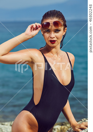 Beautiful woman on the beach. Summer holiday Beautiful woman on the beach. Summer holiday 46802248