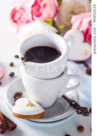 Heart shaped cookies and coffee cup gift on Valentine's Day, Mother's Day, gift, surprise, heart Heart shaped cookies and coffee cup gift on Valentine's Day, Mother's Day, gift, surprise, heart 46802638