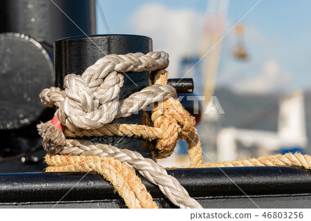 Mooring bollard with ropes or hawsers on the ship Mooring bollard with ropes or hawsers on the ship 46803256