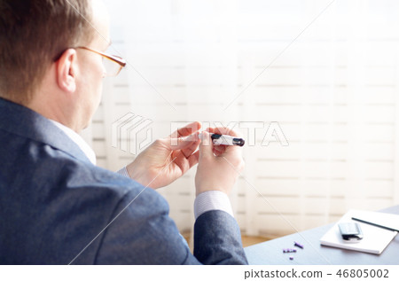 Middle age Man Pierce his fingertip Middle age Man Pierce his fingertip 46805002