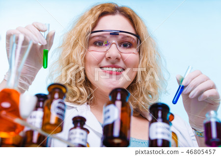 female chemistry student with glassware test flask. female chemistry student with glassware test flask. 46805457