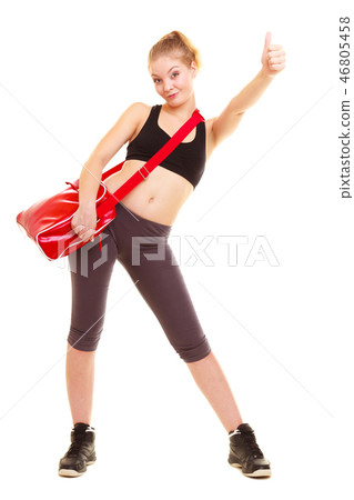 Sport. Fitness girl with gym bag showing thumb up Sport. Fitness girl with gym bag showing thumb up 46805458