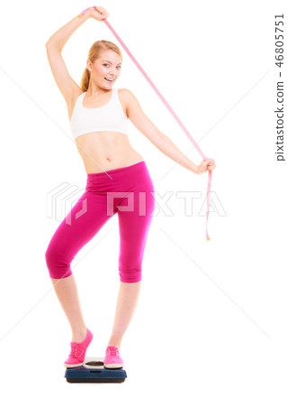 Happy woman on weighing scale. Diet weight loss. 46805751