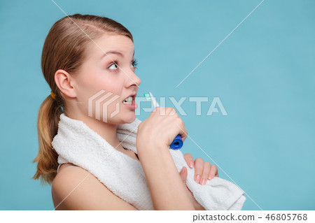 Young girl brushing oral cavity. Young girl brushing oral cavity. 46805768
