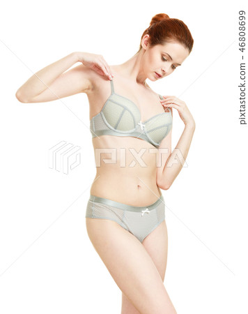 Attractive slim woman in grey matching underwear Attractive slim woman in grey matching underwear 46808699