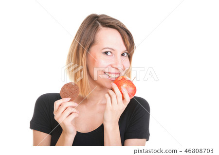Girl choose between sweet cake and red apple Girl choose between sweet cake and red apple 46808703
