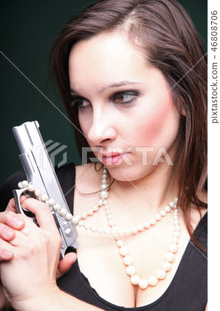 Sexy young woman long hair - gun amd pearl Sexy young woman long hair - gun amd pearl 46808706