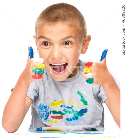 Portrait of a cute boy playing with paints Portrait of a cute boy playing with paints 46808826