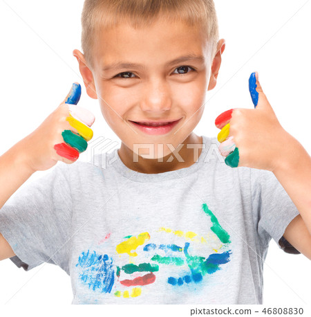 Portrait of a cute boy playing with paints Portrait of a cute boy playing with paints 46808830