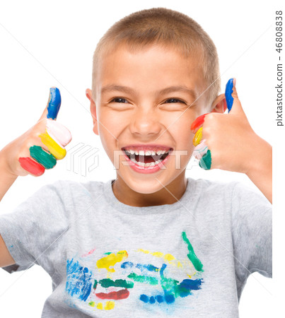 Portrait of a cute boy playing with paints Portrait of a cute boy playing with paints 46808838