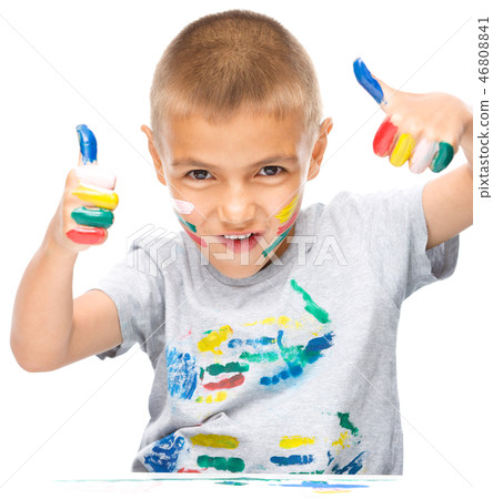 Portrait of a cute boy playing with paints Portrait of a cute boy playing with paints 46808841