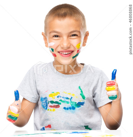 Portrait of a cute boy playing with paints Portrait of a cute boy playing with paints 46808868