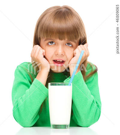 Little girl with a glass of milk Little girl with a glass of milk 46809065