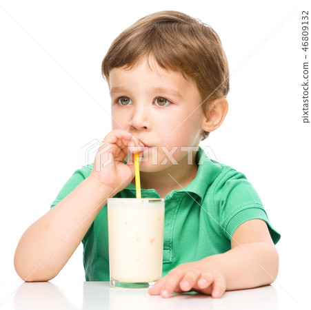 Cute little boy with a glass of milk Cute little boy with a glass of milk 46809132
